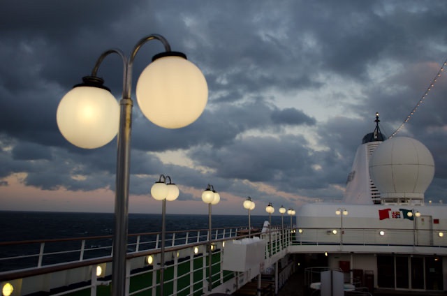 Silversea's SIlver Wind sails off into the setting sun. Photo © 2013 Aaron Saunders
