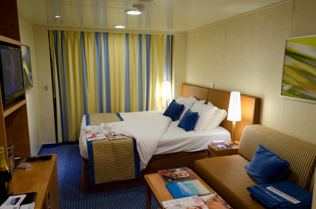 My cozy Category 8A Balcony Stateroom, turned down for the night. Photo © 2014 Aaron Saunders