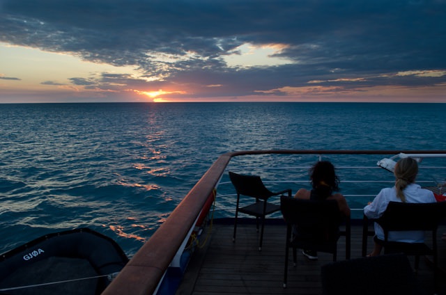 Guests take in the spectacular sunset off the coast of Western Australia aboard Silversea's Silver Discoverer. Photo © 2014 Aaron Saunders