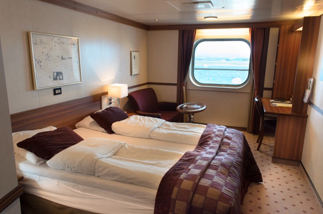 These Category F2 staterooms are spacious and inviting, and provide a generous amount of living space. Photo © 2015 Aaron Saunders