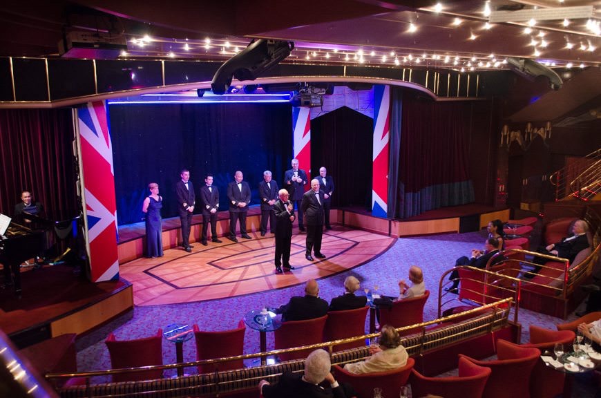 Cruise Director Colin Barbiere-Brown introduces the Captain and his Officers at the Welcome Aboard Cocktail this evening. Photo © 2015 Aaron Saunders
