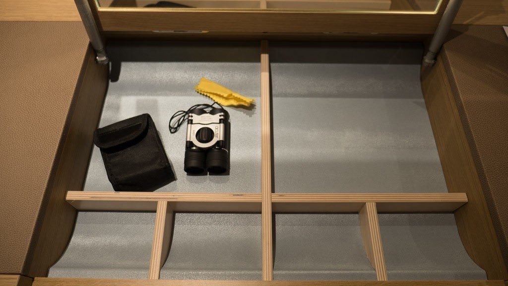 The desk has a hatch that lifts to expose a make-up mirror and storage for small items. © 2015 Ralph Grizzle